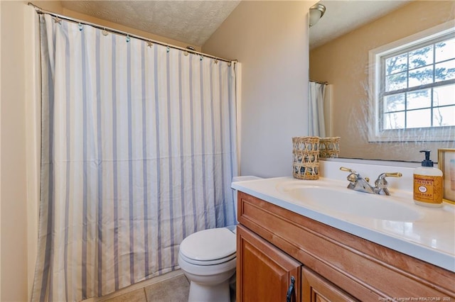 full bathroom with a shower with curtain, toilet, a textured ceiling, tile patterned flooring, and vanity