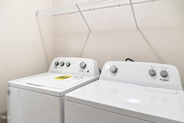 washroom with washer and dryer and laundry area