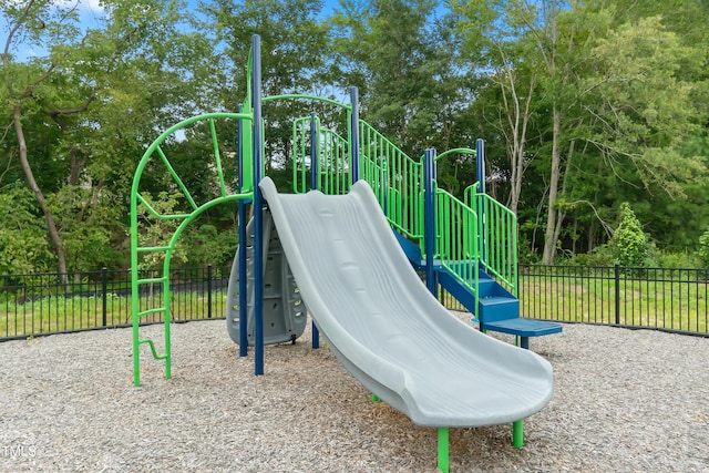 community jungle gym featuring fence