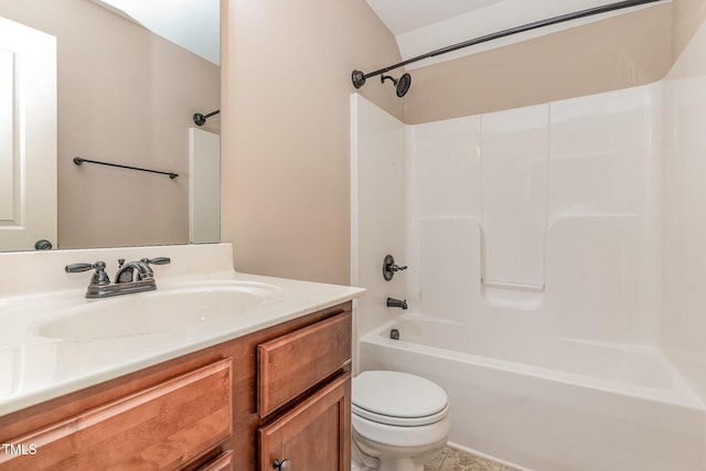 bathroom featuring toilet, bathing tub / shower combination, and vanity