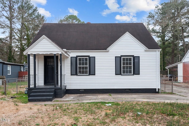 view of front of property featuring fence and crawl space