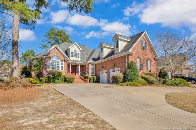 view of front of home with brick siding and concrete driveway