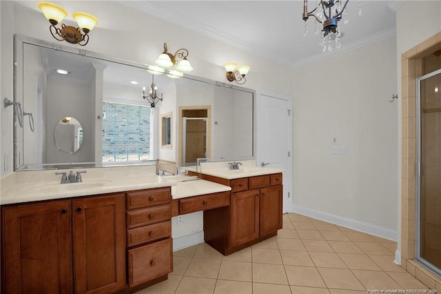 full bathroom with an inviting chandelier, a sink, a shower stall, crown molding, and tile patterned floors