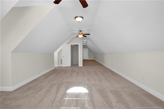 bonus room featuring carpet flooring, baseboards, ceiling fan, and vaulted ceiling