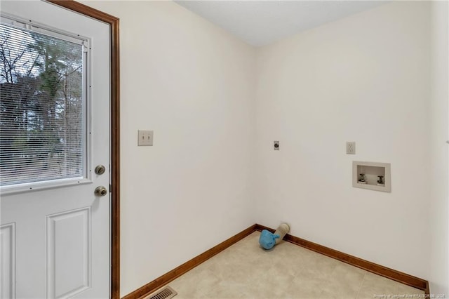 clothes washing area featuring washer hookup, laundry area, baseboards, and electric dryer hookup