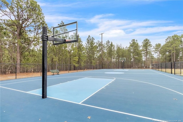 view of sport court featuring community basketball court and fence