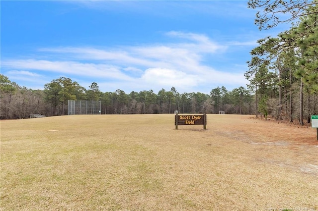 view of yard with a view of trees