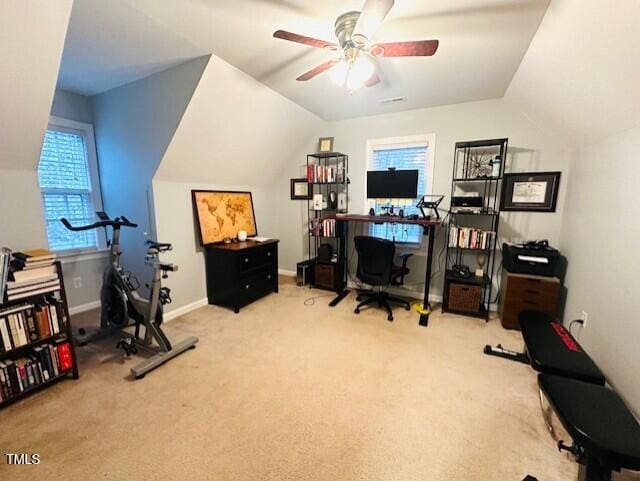 office area with baseboards, light carpet, lofted ceiling, and ceiling fan