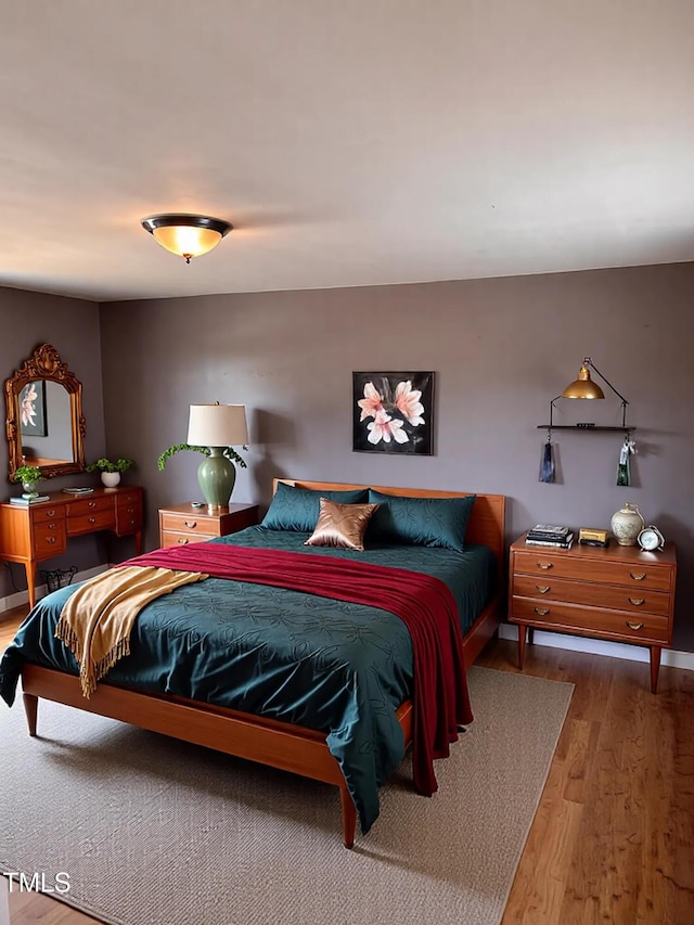 bedroom featuring wood finished floors