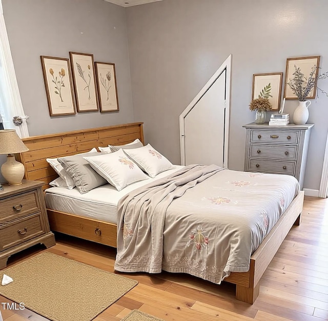 bedroom with light wood-type flooring