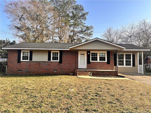 ranch-style house featuring a front yard, brick siding, and crawl space