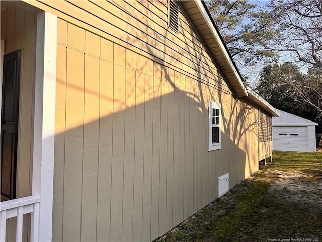 view of property exterior with an outdoor structure