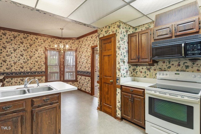 kitchen with electric range, wallpapered walls, black microwave, a sink, and a chandelier