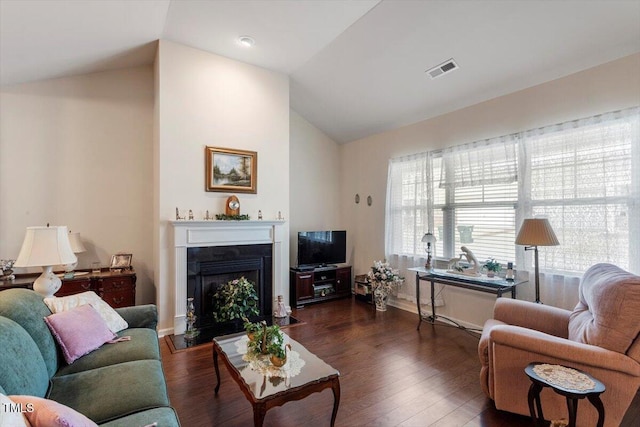 living room featuring high vaulted ceiling, a fireplace, visible vents, baseboards, and dark wood-style floors