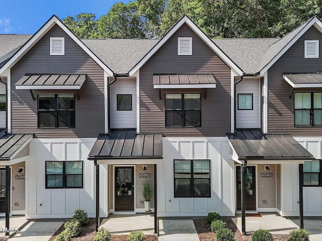 view of front of property featuring board and batten siding, metal roof, and a standing seam roof