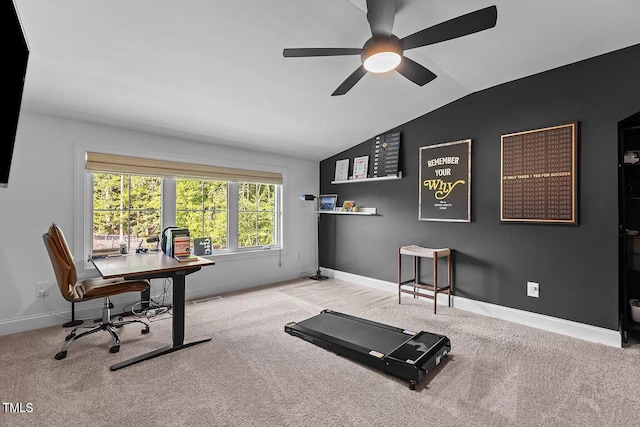 carpeted home office with lofted ceiling, visible vents, baseboards, and ceiling fan