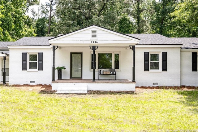 ranch-style house featuring crawl space, brick siding, and covered porch