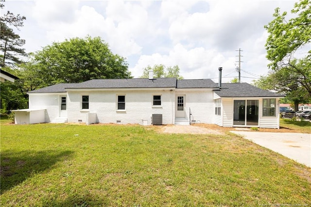 back of house with central AC, a yard, and entry steps