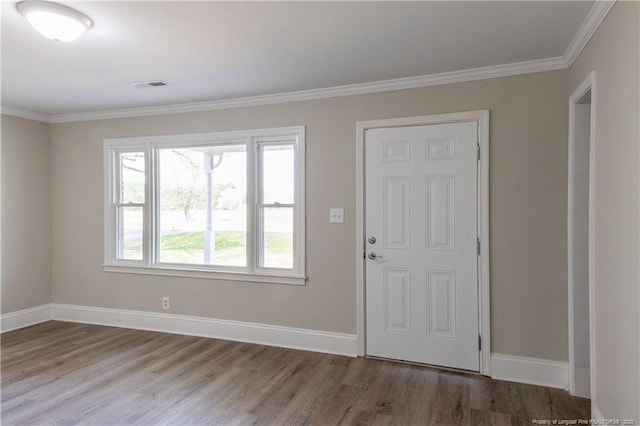 entrance foyer with wood finished floors, baseboards, and ornamental molding