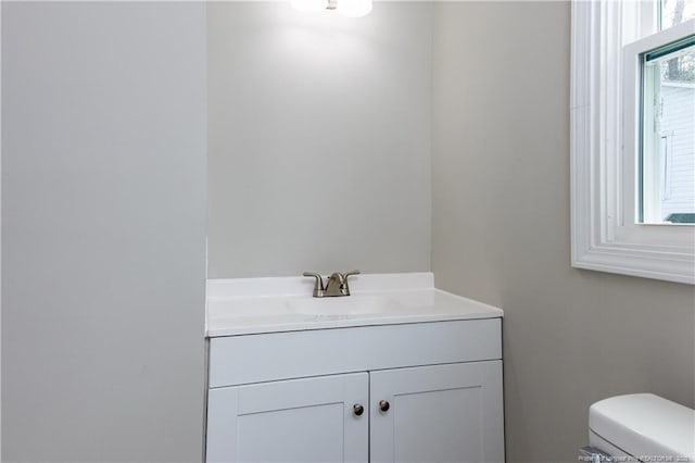 half bath with vanity and toilet