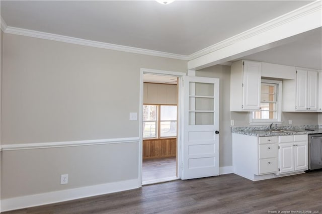 kitchen featuring white cabinets, crown molding, healthy amount of natural light, and dark wood finished floors