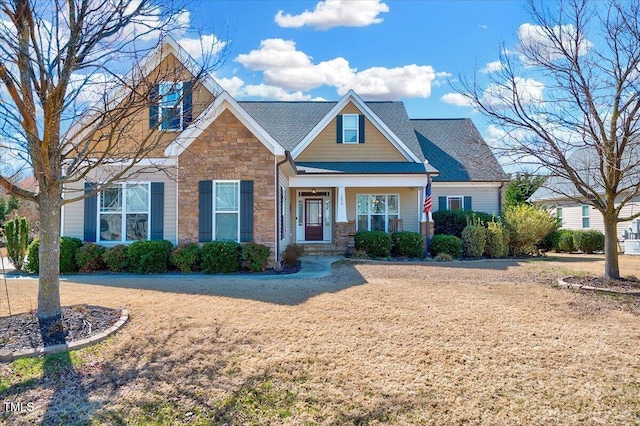 1624 Struble Cir, Willow Springs, NC 27592 - craftsman-style home with stone siding and a front lawn