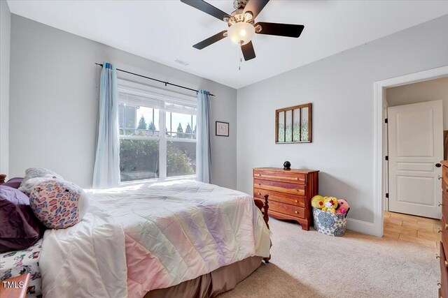 1624 Struble Cir, Willow Springs, NC 27592 - carpeted bedroom with ceiling fan and baseboards