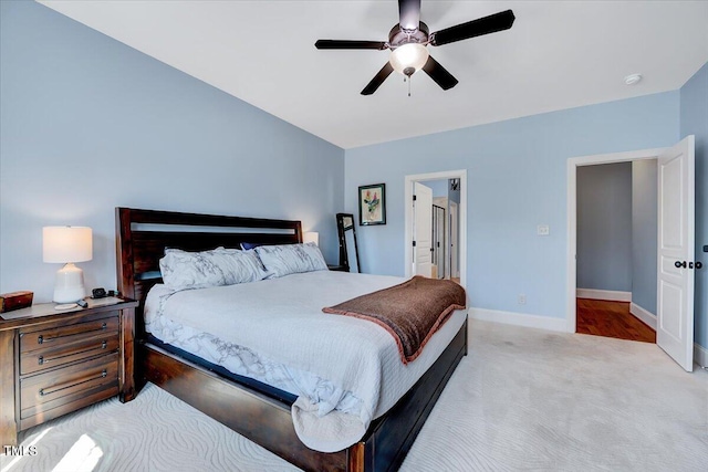 1624 Struble Cir, Willow Springs, NC 27592 - carpeted bedroom featuring baseboards and a ceiling fan