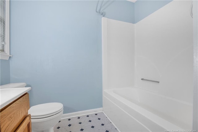 full bathroom featuring vanity, baseboards, bathing tub / shower combination, tile patterned floors, and toilet