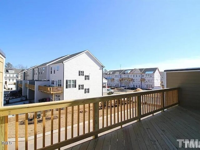 wooden deck featuring a residential view