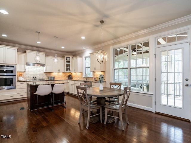 730 Toms Creek Rd, Cary, NC 27519 - dining area featuring recessed lighting, baseboards, dark wood-style flooring, ceiling fan, and crown molding