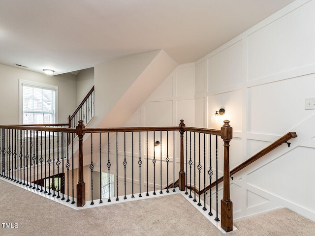 730 Toms Creek Rd, Cary, NC 27519 - staircase featuring carpet flooring, a decorative wall, and visible vents