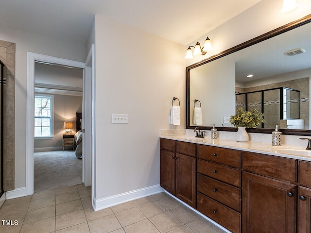 730 Toms Creek Rd, Cary, NC 27519 - full bathroom with a sink, tile patterned flooring, baseboards, and a shower stall