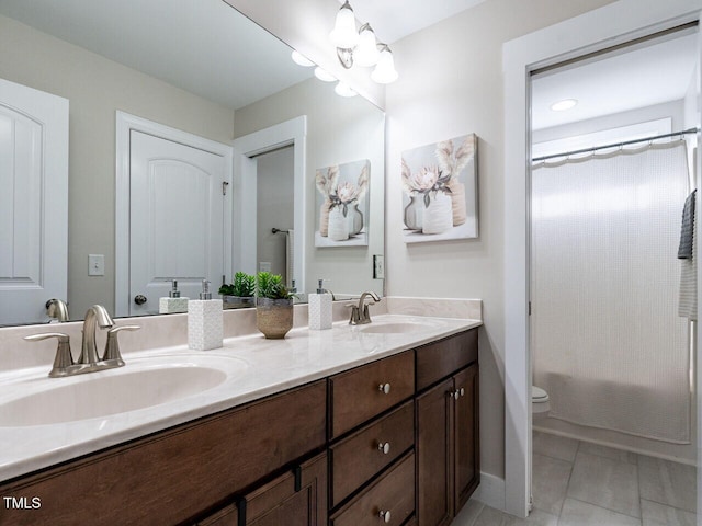 730 Toms Creek Rd, Cary, NC 27519 - full bath featuring double vanity, toilet, curtained shower, and a sink