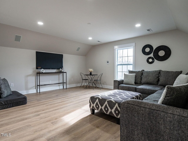 730 Toms Creek Rd, Cary, NC 27519 - living room with lofted ceiling, light wood-type flooring, and visible vents