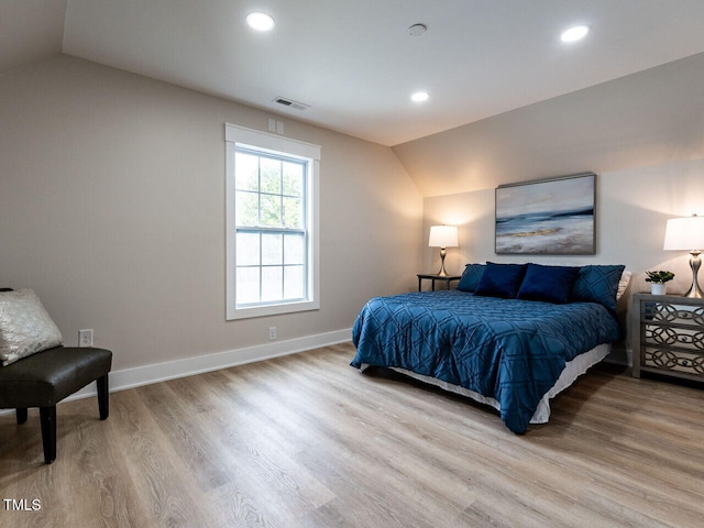 730 Toms Creek Rd, Cary, NC 27519 - bedroom featuring baseboards, wood finished floors, visible vents, and vaulted ceiling