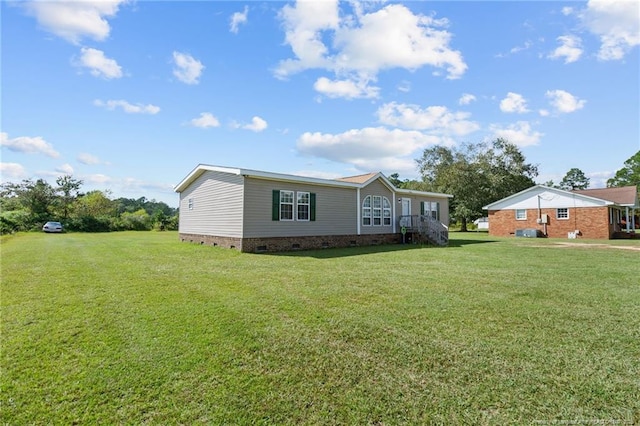 view of front of property with crawl space and a front yard