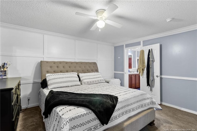 bedroom featuring a ceiling fan, a textured ceiling, crown molding, a decorative wall, and dark carpet