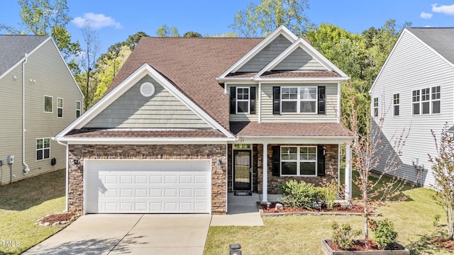 69 Florence Dr, Clayton, NC 27527 - craftsman-style home with stone siding, a front lawn, an attached garage, a shingled roof, and driveway