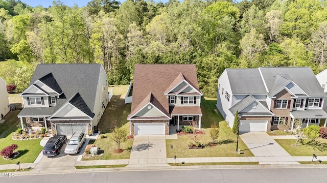 69 Florence Dr, Clayton, NC 27527 - exterior space featuring a view of trees, driveway, and stone siding