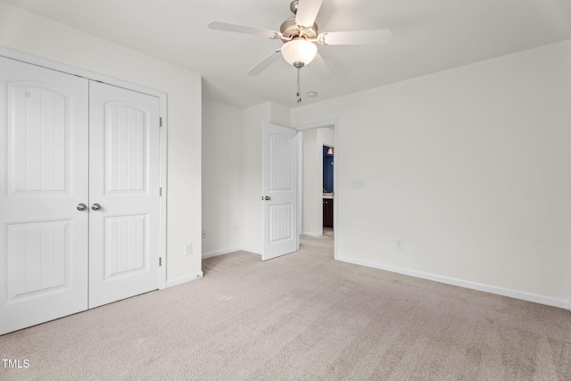 69 Florence Dr, Clayton, NC 27527 - unfurnished bedroom with carpet flooring, a closet, baseboards, and a ceiling fan