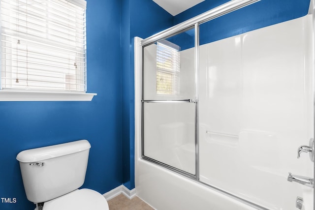 69 Florence Dr, Clayton, NC 27527 - full bath with combined bath / shower with glass door, tile patterned floors, baseboards, and toilet