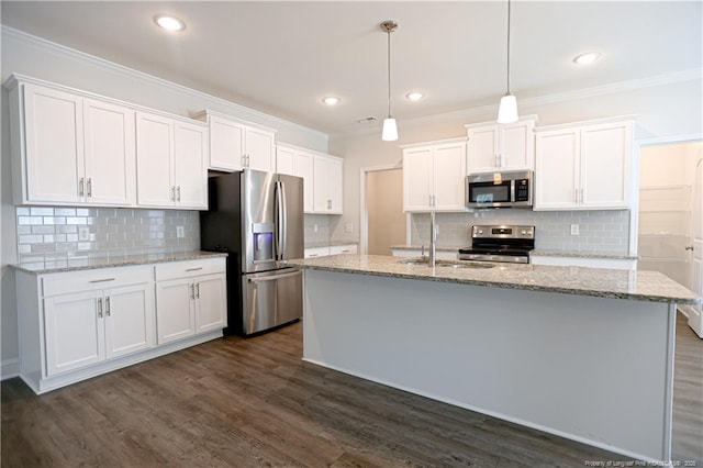 kitchen with white cabinets, dark wood-style flooring, stainless steel appliances, and crown molding