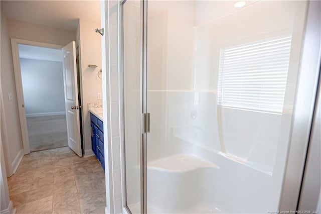 full bathroom with a stall shower, vanity, and a garden tub