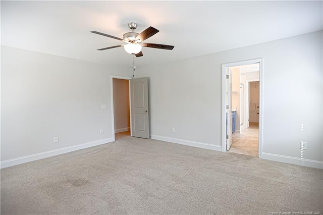 unfurnished bedroom with light colored carpet, ceiling fan, and baseboards
