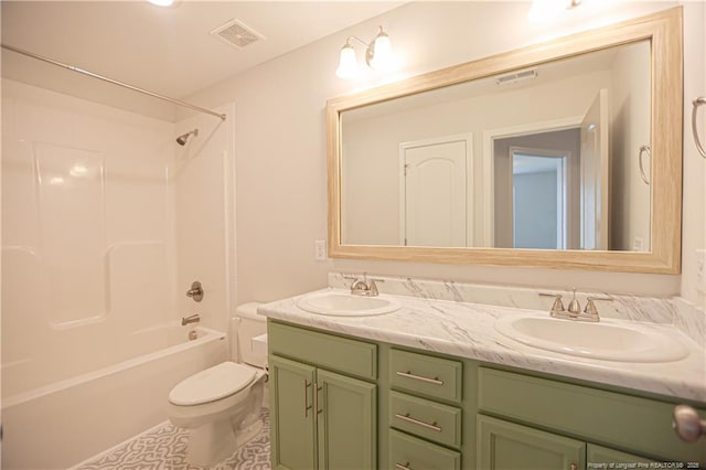 bathroom with double vanity, visible vents, and a sink