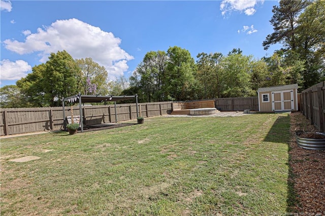 view of yard featuring an outbuilding, a fenced backyard, and a shed