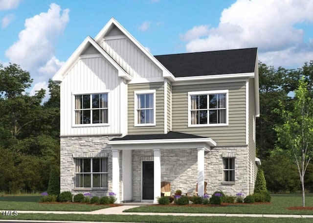 view of front of house with board and batten siding, a front lawn, and stone siding