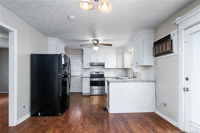 kitchen with ceiling fan, under cabinet range hood, stainless steel electric range, freestanding refrigerator, and white cabinetry