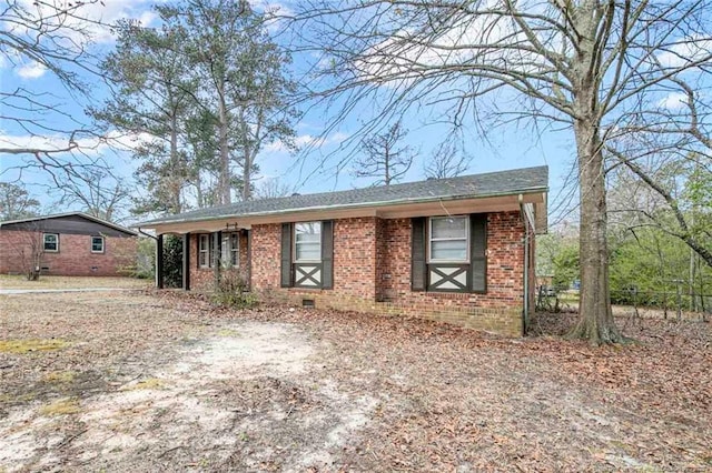 ranch-style house with brick siding